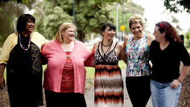 Group of women arm in arm