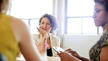 Three women professionals working together