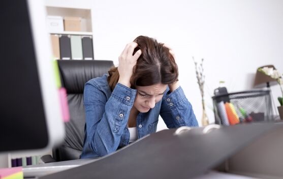 Young women in workplace stressed 600 352