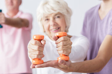 Older women holding weights