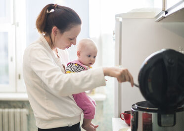 Mother and baby in kitchen
