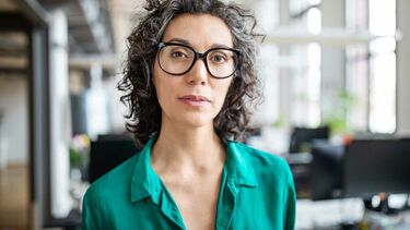 woman in menopause wearing glasses