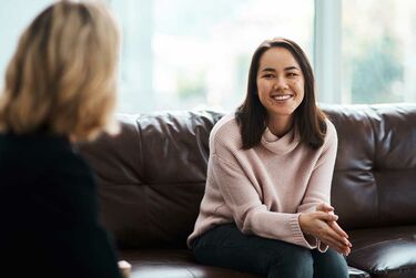 Young woman having a therapeutic session with psychologist