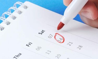 A pen circling a date on a calendar