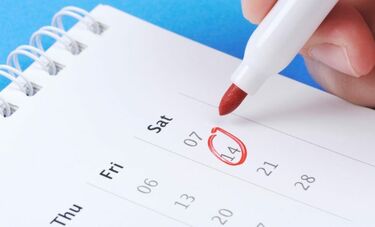 A pen circling a date on a calendar