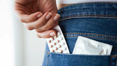 Pills in the back pocket of someone's jeans