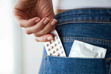 Pills in the back pocket of someone's jeans