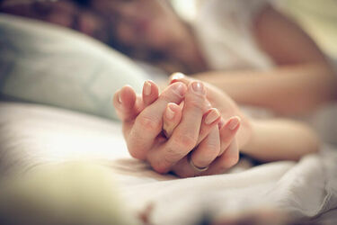 Couple holding hands