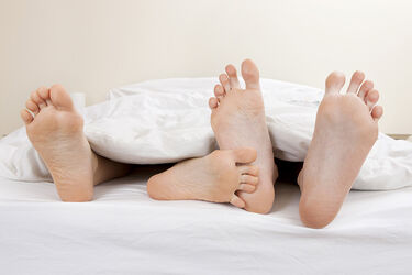 Feet in bed couple sex relationship