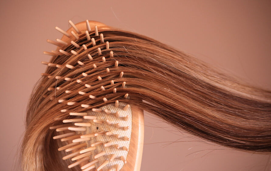 Long hair in hair brush