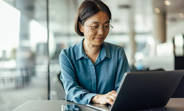 A woman working on a laptop