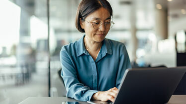 A woman working on a laptop