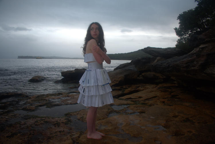Lotte Weber standing by the ocean