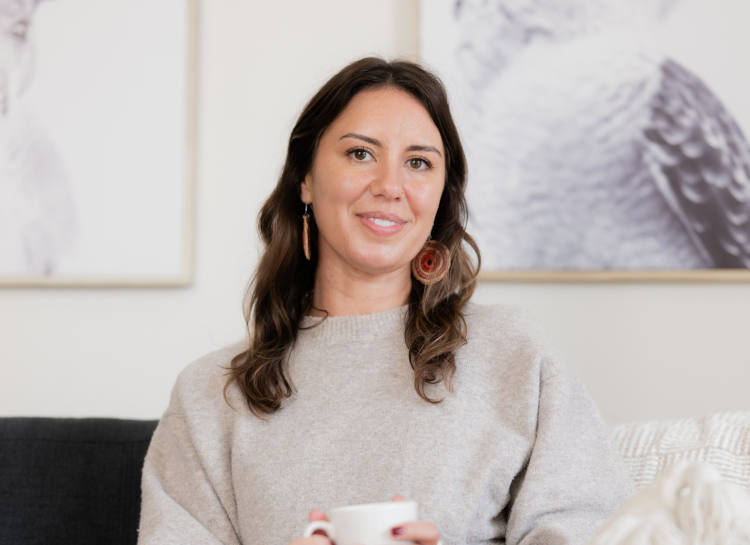 A smiling woman on a couch